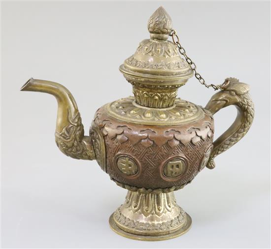 A Tibetan bronze and brass repousse work water sprinkler, 19th century, H. 21cm